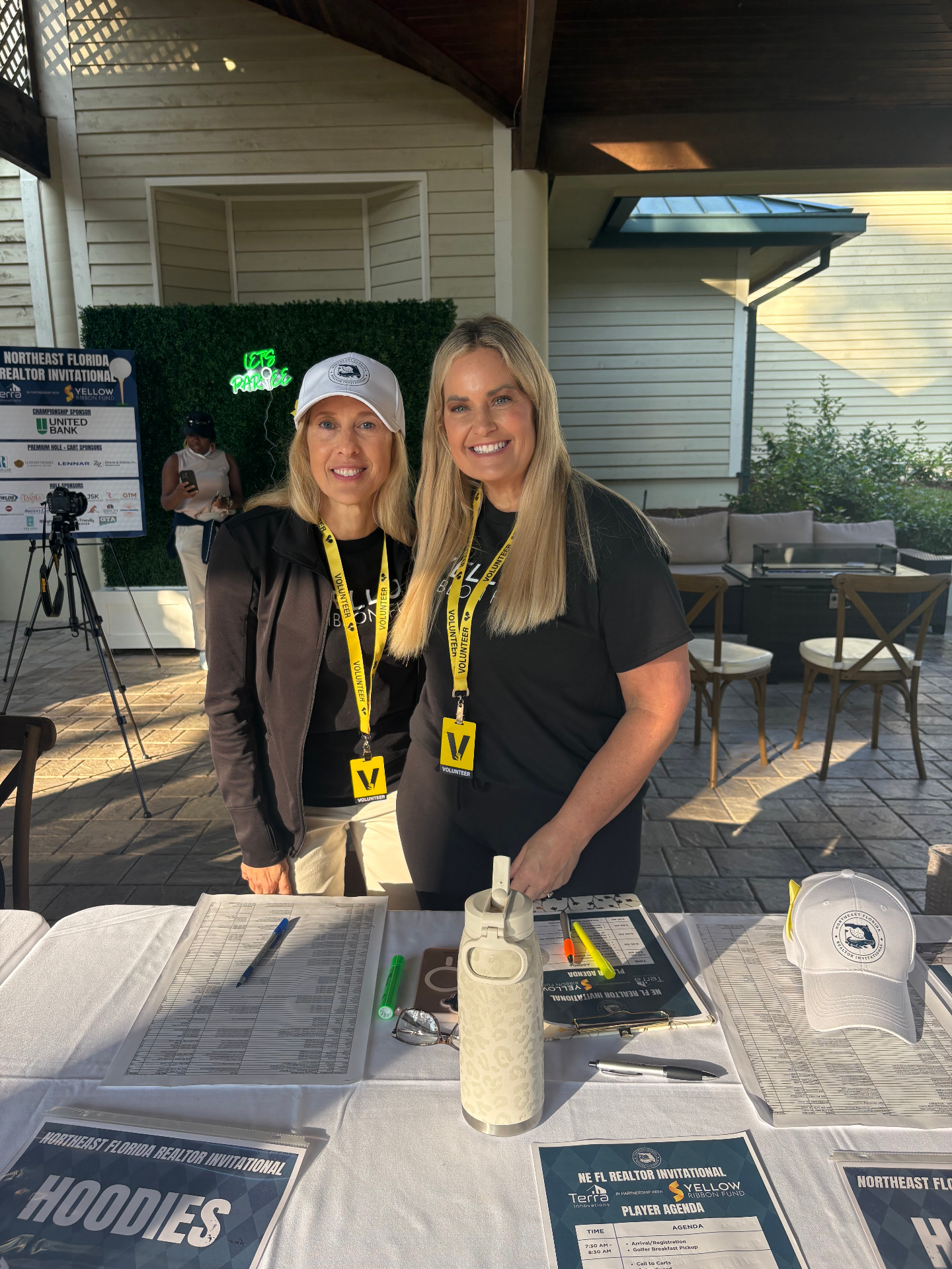 Volunteers Jessica and Kathy at player check-in