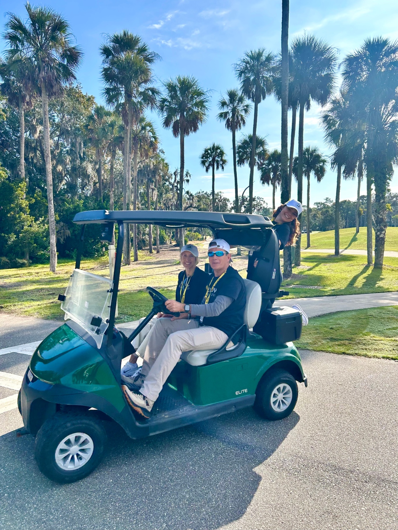 Volunteers cruising the course in a golf cart