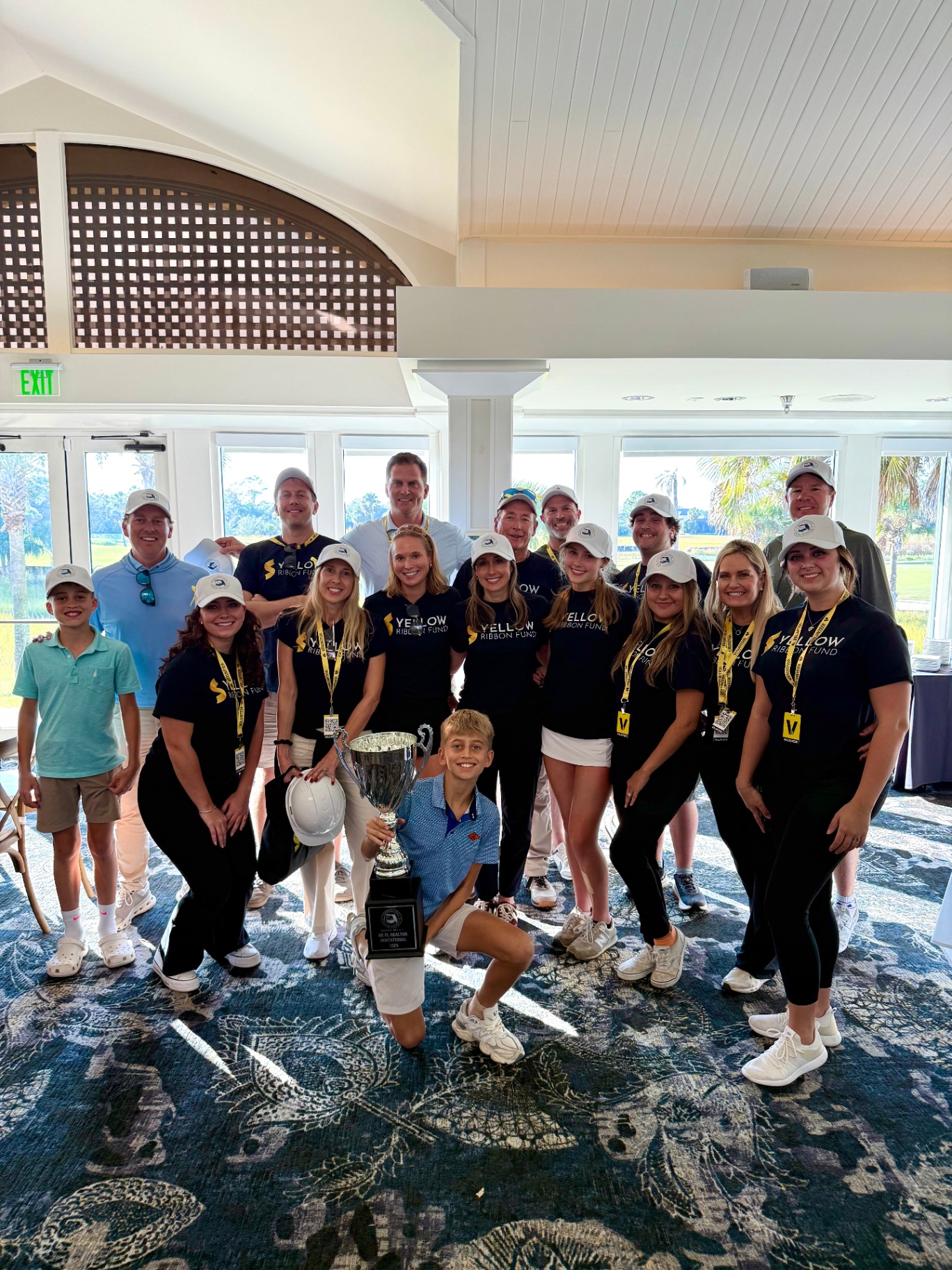 Yellow Ribbon Fund team with the 2025 NE FL Invitational trophy