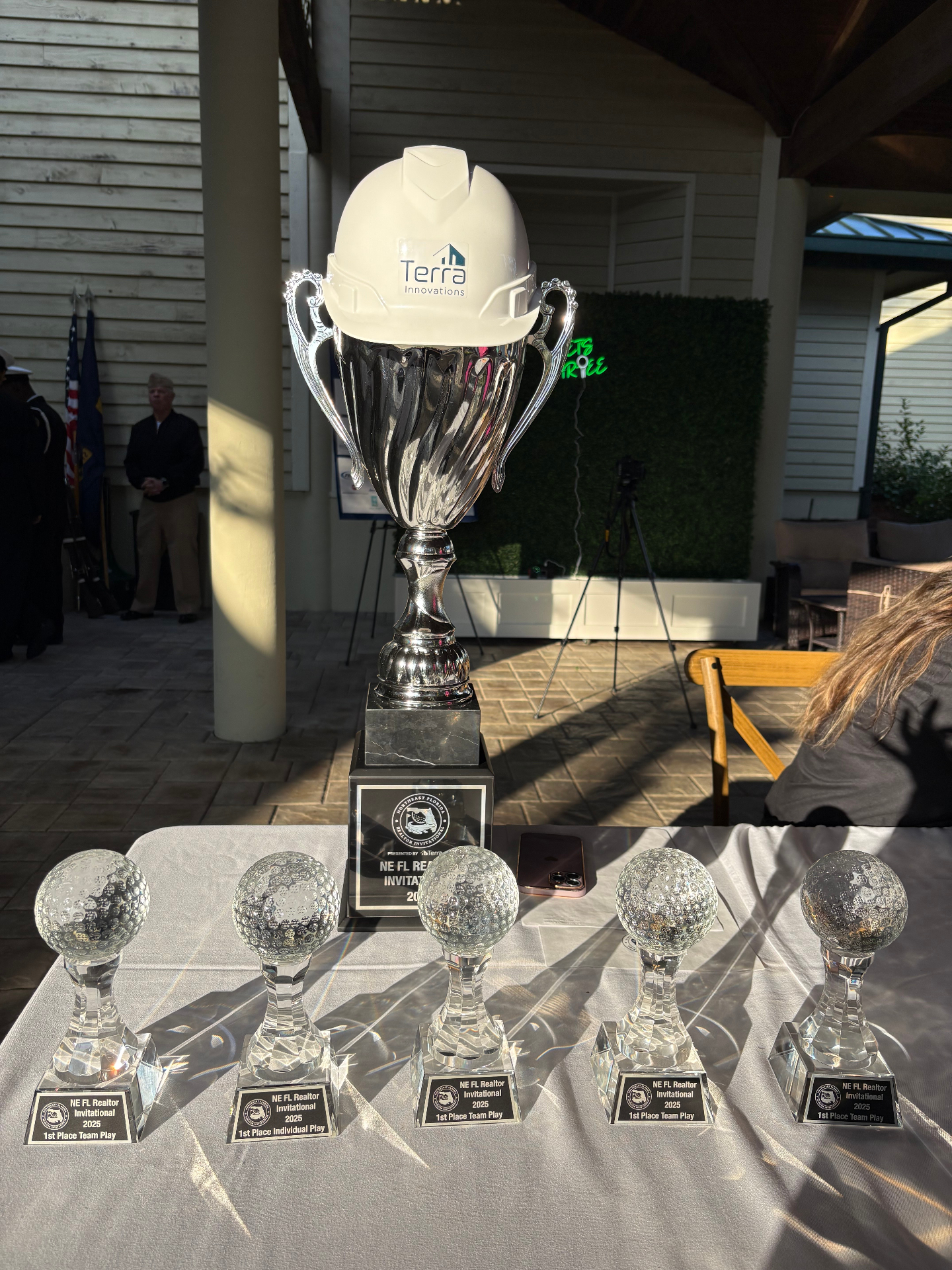 2025 NE FL Realtor Invitational championship trophy and 1st place crystal awards